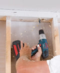 Bosch DSB1013 Daredevil spade bit installed in cordless drill drilling wood