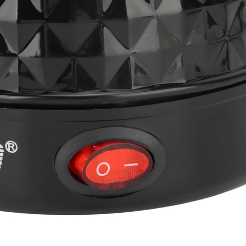 Close-up of red power switch on the Go To Electric Coffee Maker 600ml Portable Stainless Steel Pot with textured black surface.