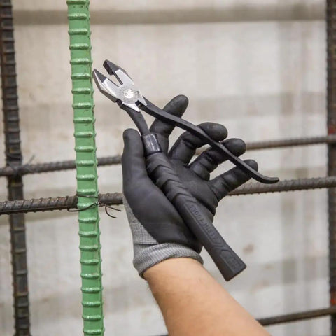 Hand wearing glove holding pliers using Plier Cushion Grip Kit With Heat Shrink Bands For Slim-Head Ironworker Pliers 201-7CST