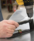 Using Go-To Adjustable Hole Cutter 2 To 12 Inch for precise metal cuts in sheet metal with built-in scale and drill attachment.