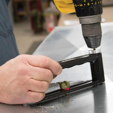 Using Go-To Adjustable Hole Cutter 2 To 12 Inch for precise metal cuts in sheet metal with built-in scale and drill attachment.