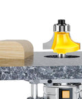 Pro Grade Four Piece Roundover Router Bit Set With One Quarter Inch Shank And C3 Carbide Cutters used on wood to create rounded edge.