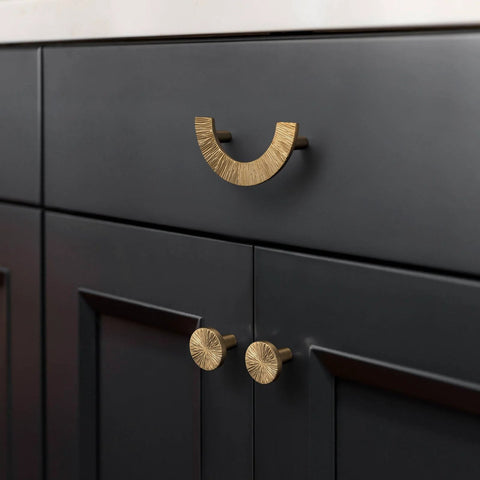 Champagne Bronze Cabinet Knobs Set 1.1 Inch Diameter Zinc Alloy Drawer Pulls for kitchen cabinets shown on dark wood cabinetry