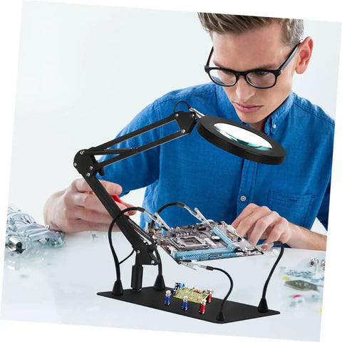 Person using Six Piece Soldering Clamp Adjustable Welding Fixture With Magnifying Glass Lamp Clamp For PCB Board DIY Electrical Work Handy Versatile Arm Soldering Station Tool For Pro Projects at workstation