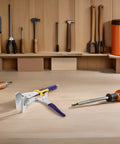 Sheet Metal Hand Seamer Pliers With Straight Jaw And Locking Clamp For Metal Bending Fabrication And HVAC Projects on workbench.
