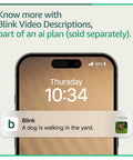 Smartphone displaying notification "A dog is walking in the yard" with Blink Video Descriptions service information