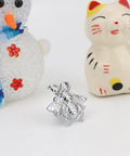 Bee Shape Brass Drawer Knob in silver finish displayed with snowman and cat figurines.