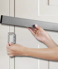 Person installing Heavy Duty Door Security Bar With Brackets Kit For Front Door, Easy Four Screw Install, shown in use.
