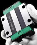 Heavy Duty Linear Guide Block With 4 Row Ball Bearings For CNC Router 3D Printer And Automation Gear Workhorse Carriage On High Precision Linear Rail For Smooth Reliable Motion, steel carriage in gloved hand