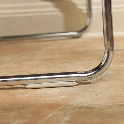 Self Stick One Half Inch By Four Inch Furniture Sliders For Carpet And Hard Surfaces Beige Four Pack installed on chair leg for smooth floor glide