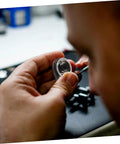 Pro Grade Mechanical Alarm Clock Repair Kit With Precision Springs in use, showing precision springs and winding key assembly.
