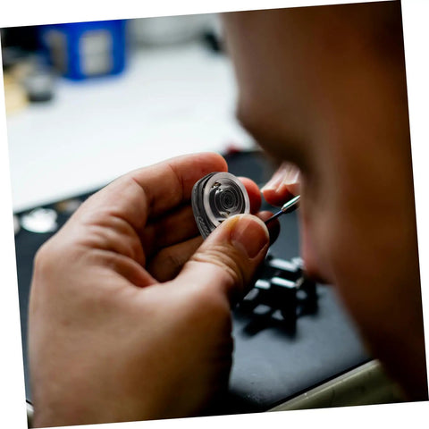 Pro Grade Mechanical Alarm Clock Repair Kit With Precision Springs in use, showing precision springs and winding key assembly.