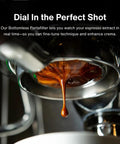 Close-up of espresso flowing from 54mm bottomless naked portafilter for Breville 54mm machines with olivewood handle.