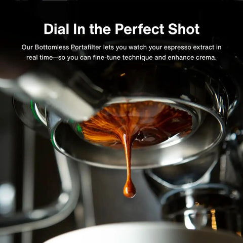 Close-up of espresso flowing from 54mm bottomless naked portafilter for Breville 54mm machines with olivewood handle.