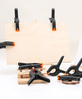 10-pack 6-inch black plastic spring clamps with orange tips for crafts and photography backdrops