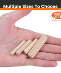 Hand holding multiple sizes of 100 Count Solid Wood Dowel Pins Half Inch By Two Inch Kiln Dried Hardwood Fluted Beveled.