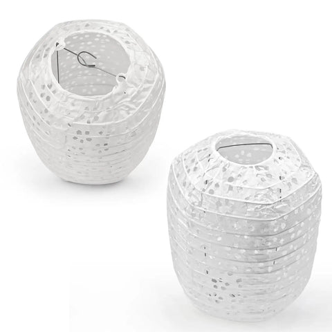 Two white 6.3 inch oval hollow lanterns, part of Ten Pack White Paper Lanterns 6.3 Inch Oval Hollow Hanging Lanterns For Chinese Japanese Style Festive Decor