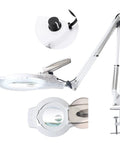 Lit 2200L LED Magnifying Lamp With Stand Real Glass Lens Dimmable Light shown in close-up with adjustable arm and clamp