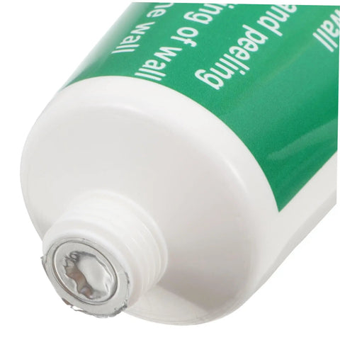 Close-up of Two Set Wall Mending Cream Kit Quick Drying Drywall Crack Repair Paste tube opening with green label