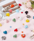 Heart Shaped Porcelain Cabinet Knobs Set 24 Pieces In 12 Colorways Ceramic Kitchen Dresser Knobs on pink surface with screws