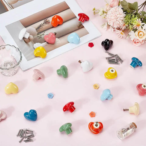 Heart Shaped Porcelain Cabinet Knobs Set 24 Pieces In 12 Colorways Ceramic Kitchen Dresser Knobs on pink surface with screws