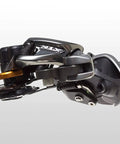Close-up of XTR Di2 Rd M9050 Rear Derailleur Black Medium Cage for trail and mountain bikes, showcasing low profile design and E Tube wiring.