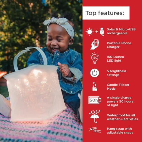 Child holding an inflated solar camping lantern with phone charger, featuring top product features for outdoor adventures.