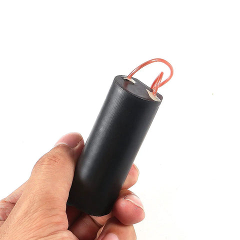 Hand holding High Voltage Boost Module From 3V To 6V Input To 400kV Output Two Pack DC Step Up Power Transformer for lab projects.