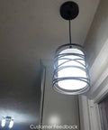Sleek Modern Mini Pendant Light For Kitchen Island And Dining Room With 6.3 Inch Matte Black Spiral Cage And Handblown Frosted Glass Shade Adjustable Cord 1 Pack illuminated in home setting