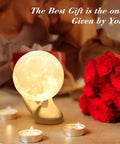 3.5 Inch 3D Moon Lamp With Ceramic Base Touch Dimmable LED Night Light for Kids Room, next to candles and roses