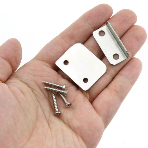 Heavy Duty Nickel Plated Drawer Stopper Set L Shaped And Straight Cabinet Back Braces Rust Proof Wardrobe Guards Pro Grade Hardware with screws in hand.
