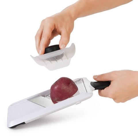 Handheld Mandoline Slicer For Kitchen With Adjustable Slices In 1mm 2.5mm 4mm, Secure Non Slip Handle, slicing a potato