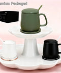 Smart Temperature Control Heated Coffee Mug 13 Oz Premium Ceramic Warm Auto Heater holds an olive green mug on a stand.