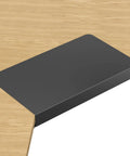 17 Inch Black Corner Desk Extender For L Shaped Workstations mounted on a wooden desk corner.