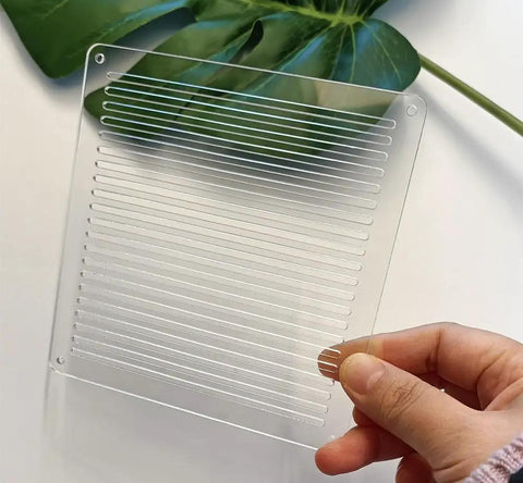 Straight Up Reliable Acrylic Sashiko Stencil For Quilting And Embroidery Crafts 2Mm Thick reusable template held above a plant.