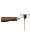 Top Shelf 58mm Bottomless Portafilter With Smooth Walnut Grip For Breville Dual Boiler And Oracle Series Home Barista Upgrade delivering espresso.