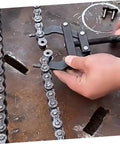 User adjusting a motorcycle chain using Pro Level Motorcycle Chain Tensioner Tool For Quick Adjustment And Easy Chain Removal Compact Bike Chain Adjuster.