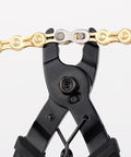 Go To Bicycle Chain Link Pliers Master Link Tool for quick removal and repair, black tool gripping a chain link