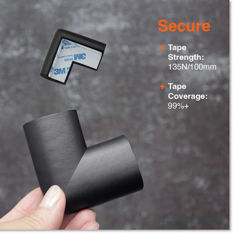 Hand holding 4 Large Corner Protectors For Baby Safety Heavy Duty Childproofing Rubber Foam Bumper Guards Adhesive Pre-Taped Black Onyx