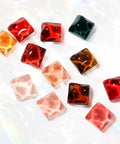 Transparent Icy Jelly Gel Nail Polish Kit With Soak Off UV LED Hema Free Vegan various colored gel cubes on white surface