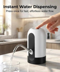 Handy Rechargeable Electric Fluid Pump For Water And Oil With Portable USB Dispenser dispensing water into a glass on kitchen counter.