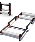 Indoor Bike Roller Trainer With Parabolic Rollers Ride Ready Adjustable Foldable Aluminum Stand displayed in open and folded positions.