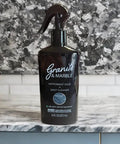 Bottle of Daily Stone Cleaner Spray For Granite, Marble And Quartz With Peppermint Sage Scent on counter, 16 oz