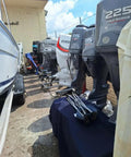 Outboard motors lined up outdoors, next to a boat, with covers; All Weather Cover For Joystick Control Unit Model 4113315 Multicolored Finish Built To Last Tough As Nails Weatherproof Shield For Outdoor Gear Keeps Dust Rain And Sun Off Your Controls Easy Install