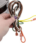 Hand holding wires of Condenser HVAC Motor 1/6 HP, 1 Phase, 208/230V, 825 RPM Replacement With Included Run Capacitor