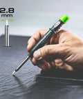 Hand using Ten Lead Dry Pencil Case White Finish Model 4043 With Mechanical Pencil Refills Bundle for Drawing on black surface