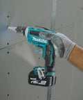 Person using 18V LXT Brushless Cordless Drywall Screwdriver Bare Tool With Push Drive Technology And Lock On Mode