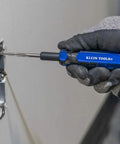 Using Klein Tools Triple Thread Taps Kit For 6 32 8 32 10 24 With Quick Rethreading to fix threads in a wall outlet plate.