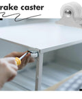 Close-up of Ultra Silent PVC Caster Wheels for Office Chairs and Furniture being installed on a small furniture piece.