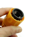 Close-up of a yellow ABS plastic fitting from the Two Pack Half Inch Garden Hose Repair Kit With No Fuss Quick Connect Fittings.